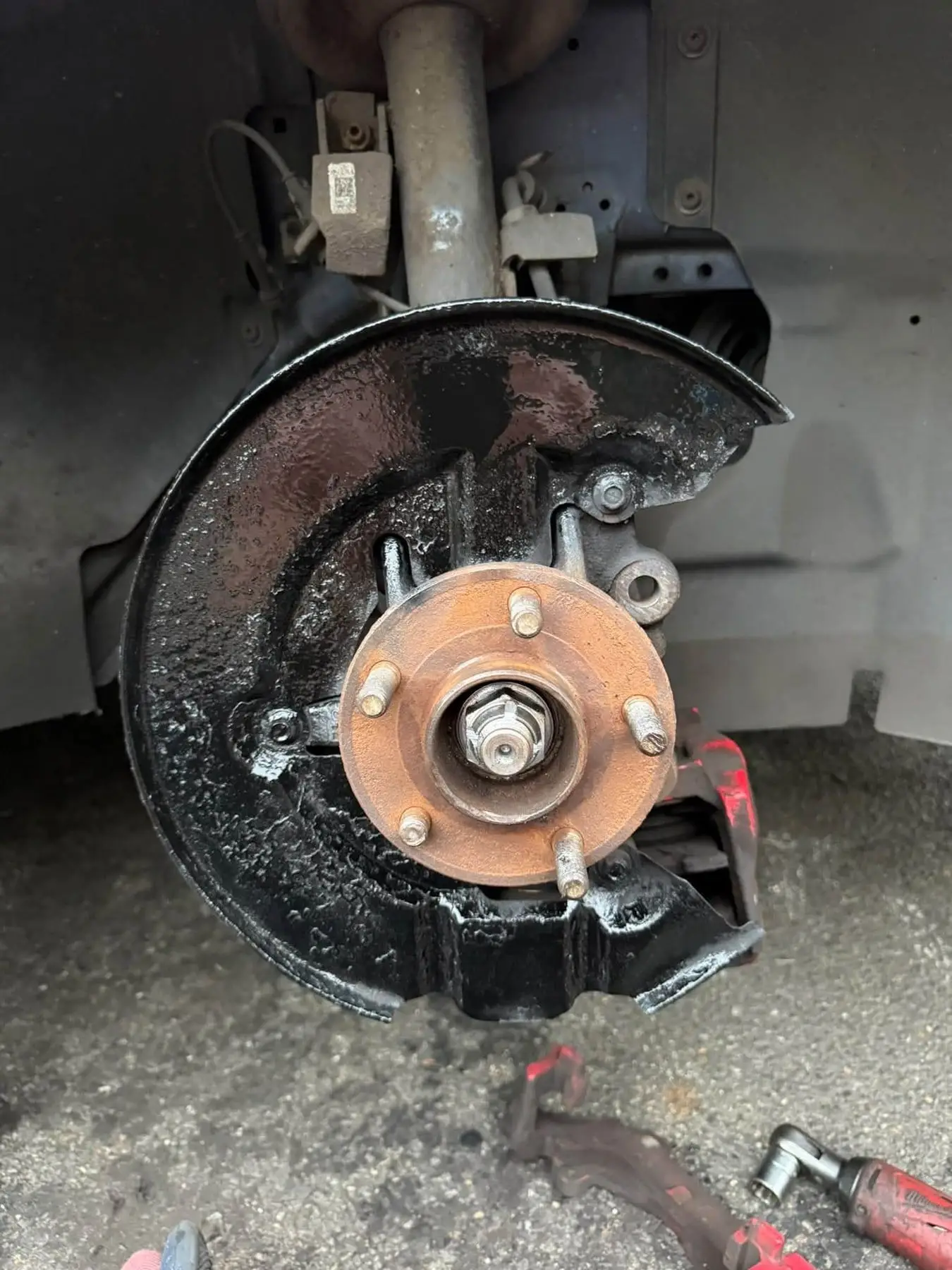 Front wheel hub exposed with the brake disc removed